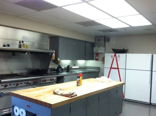 A kitchen with a refrigerator that has the letter a on it