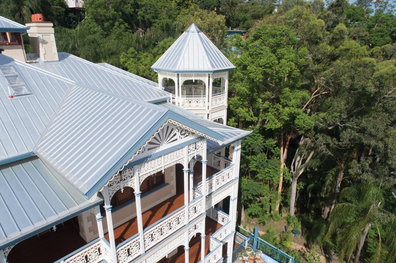 An Aerial View of a Large House Surrounded by Trees — Andergrove Plumbing & Drainage Pty Ltd In Richmond, QLD