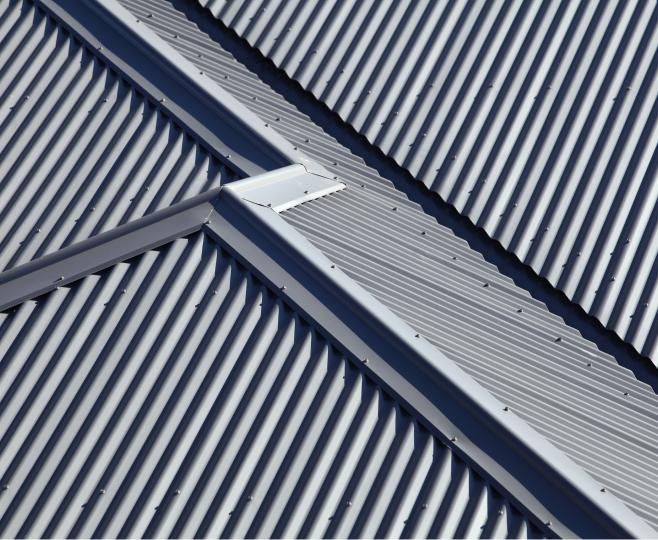 A Close Up of a Corrugated Metal Roof — Andergrove Plumbing & Drainage Pty Ltd In Richmond, QLD