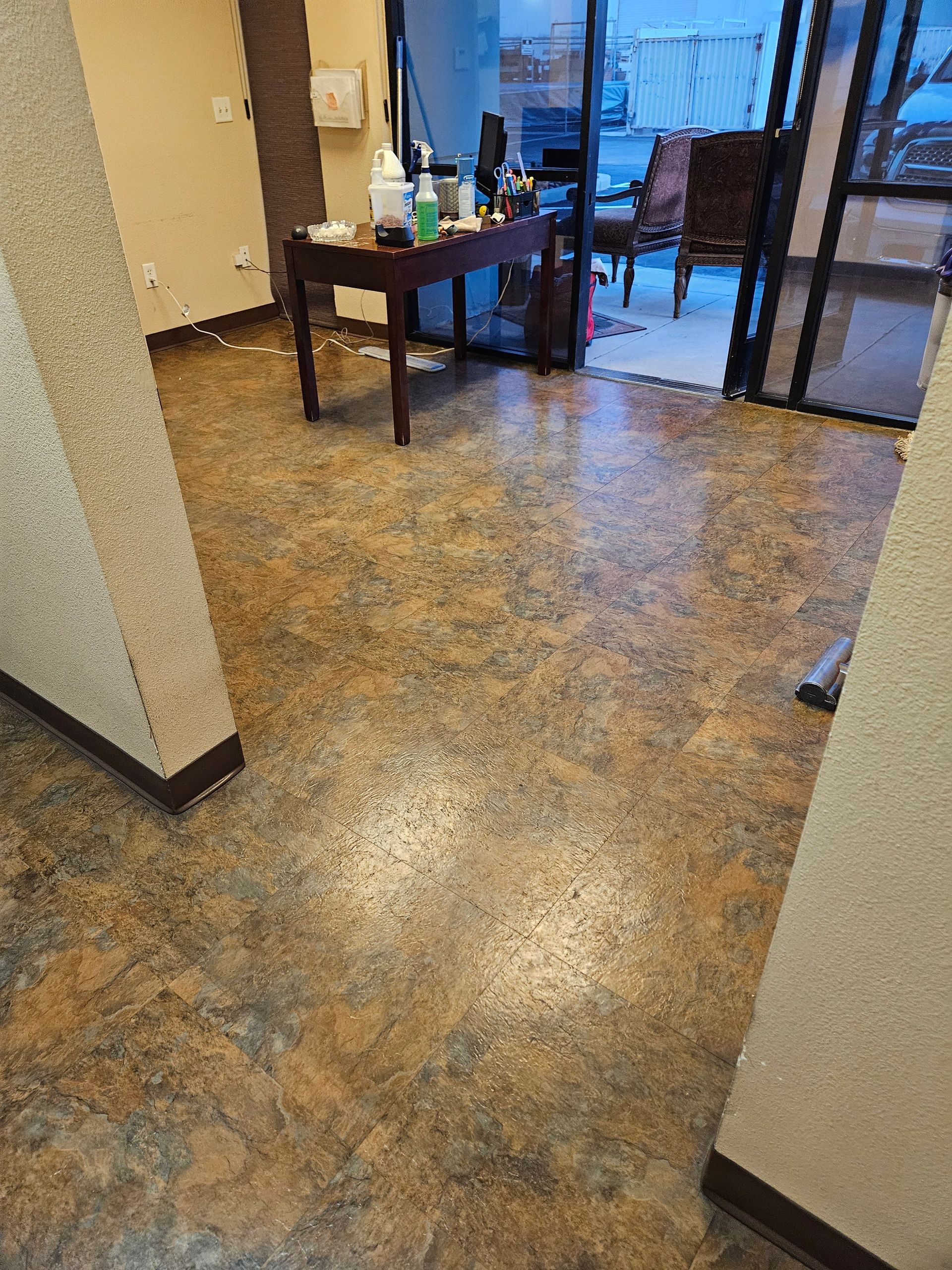 A room with a table and chairs on the floor.