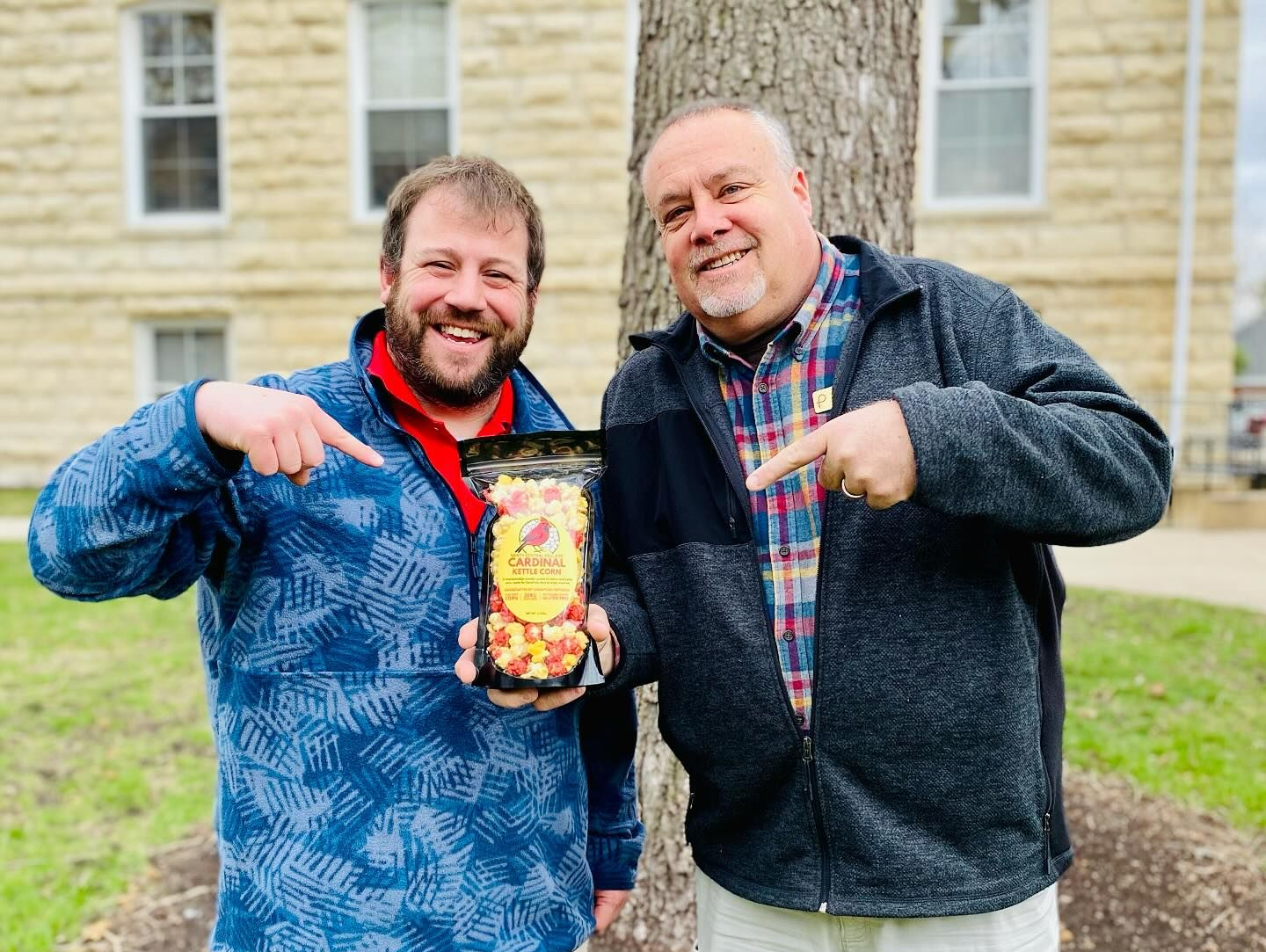A man in a chef 's hat is posing for a picture with two other chefs