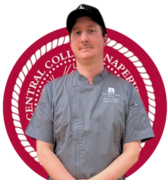 A chef wearing a grey uniform and black cap stands in front of a circular North Central College logo.