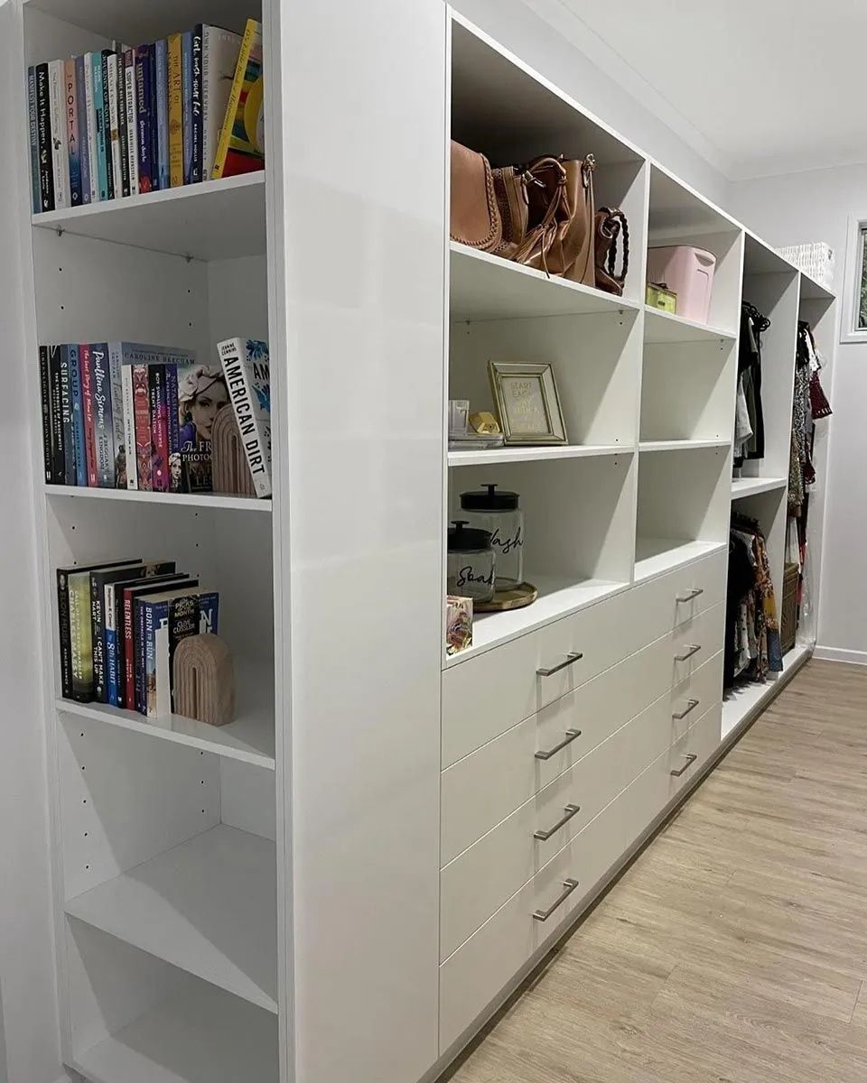 White Built-in Closet With Shelves Holding Books — Keilbach Kitchens in Innisfail, QLD