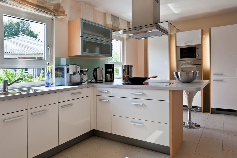 Modern White Kitchen With Island, Stainless Steel Appliances — Keilbach Kitchens in Garradunga, QLD