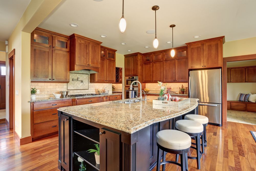 Kitchen With Dark Wood Cabinets — Keilbach Kitchens in Cairns, QLD