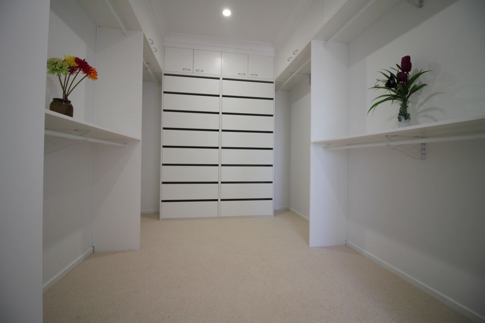 Walk-in Closet With White Shelves — Keilbach Kitchens in Cassowary Coast, QLD