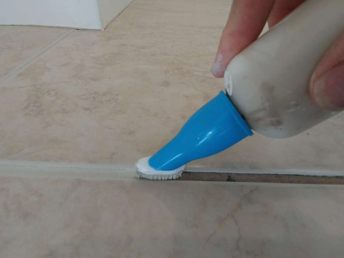 Applying grout on tiles