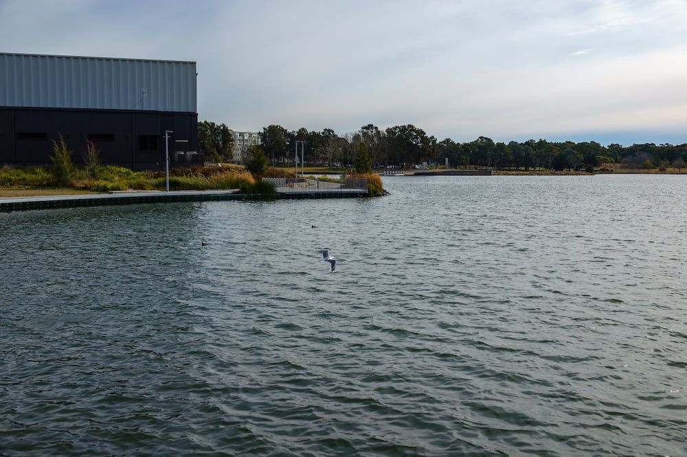 A Large Body Of Water With A Building — Proud Cleaning Canberra in Belconnen, ACT