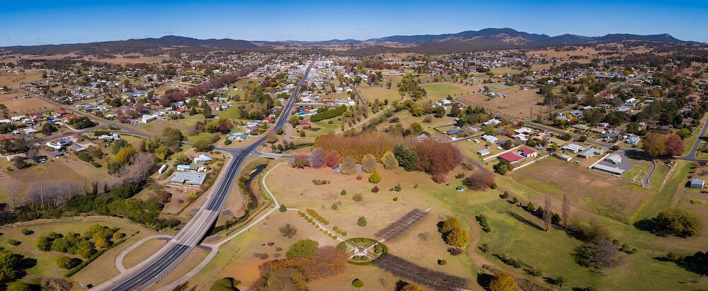 An Aerial View Of A Small Town Surrounded By Fields And Trees — Proud Cleaning Canberra in Red Hill, ACT
