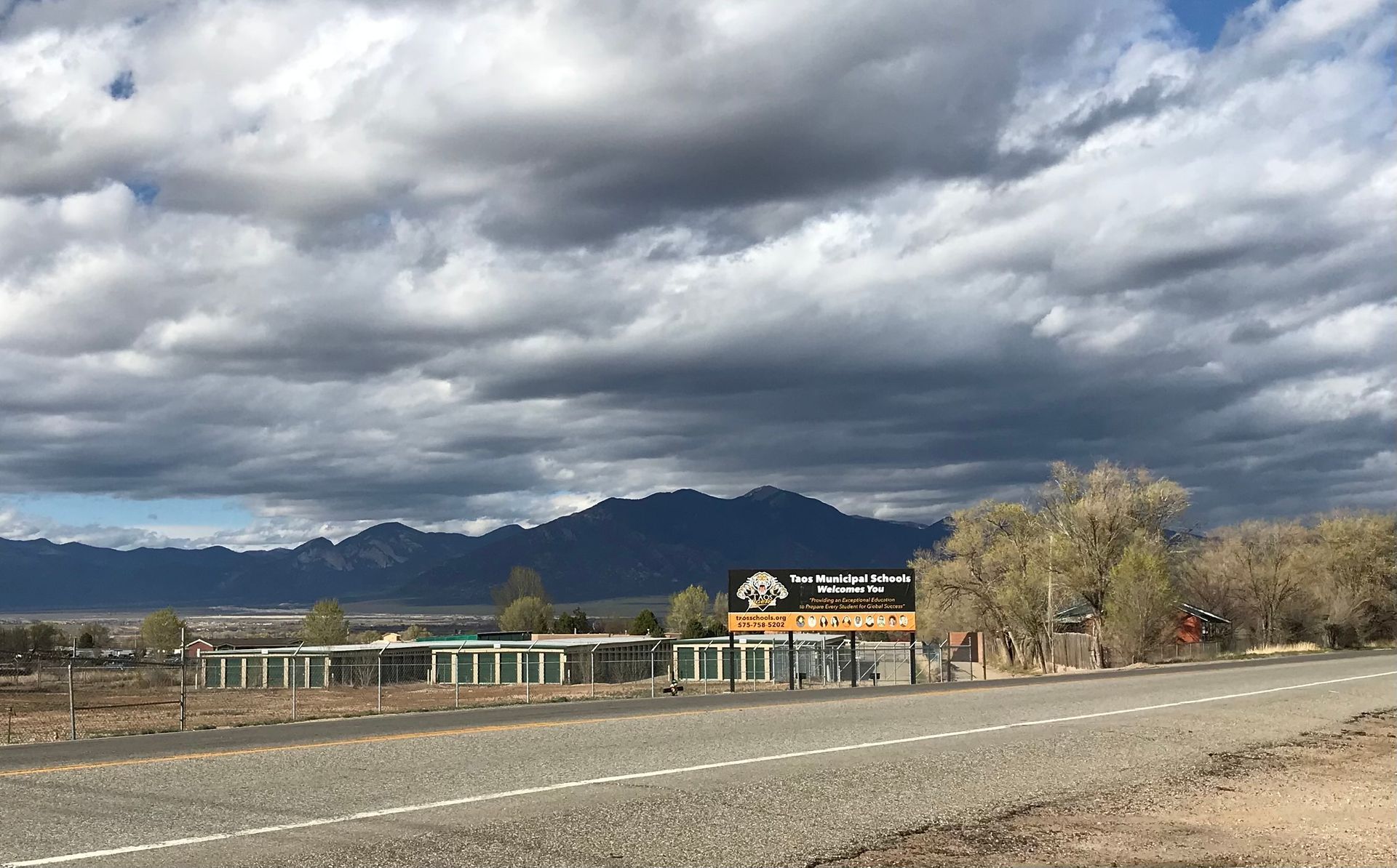 Best Price Storage Units in Ranchos de Taos as seen from across the street with a view of Taos Mountain behind them.