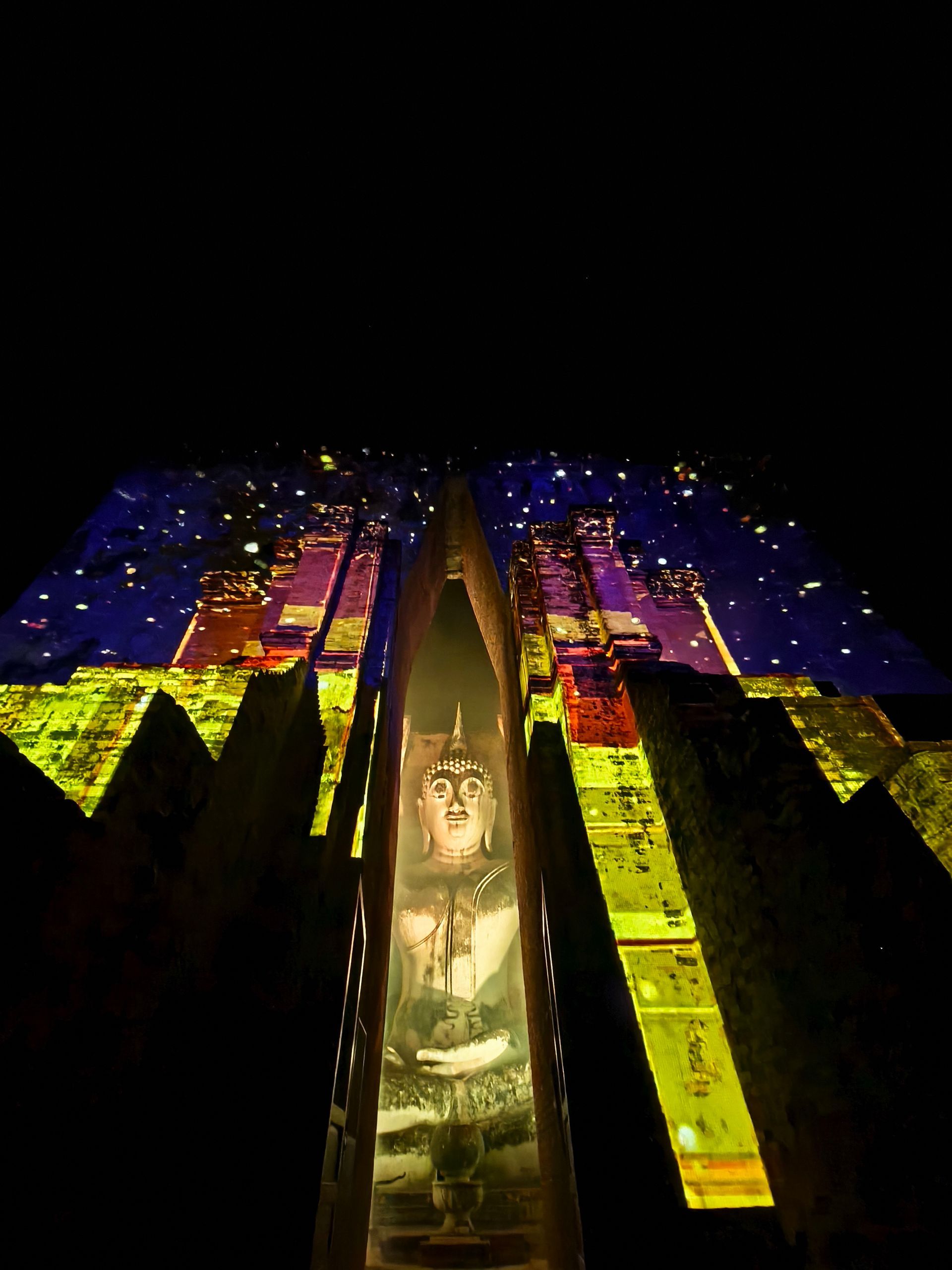The ancient Phra Achana Buddha statue at Wat Si Chum beautifully illuminated in light show