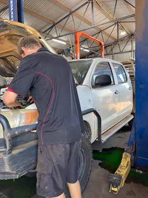 Mechanic Working On A White Truck In A Garage — KND Autos in Berrimah, NT