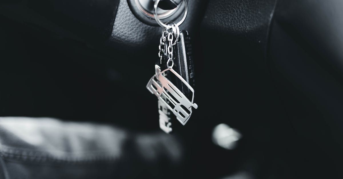 A close up of a car key in the ignition lock.