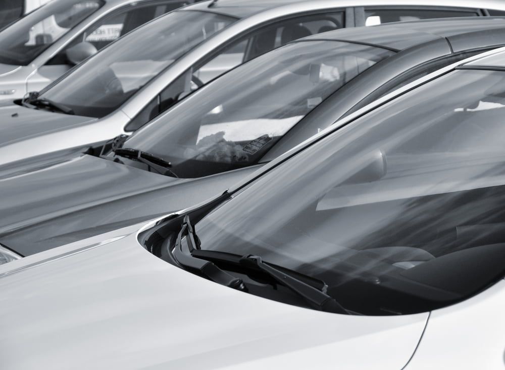 A Black and White Photo of A Row of Cars Parked Next to Each Other — A1 Windscreens in Gunnedah, NSW