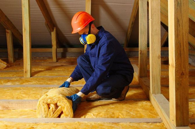 Installing Insulation into an attic in centennial co