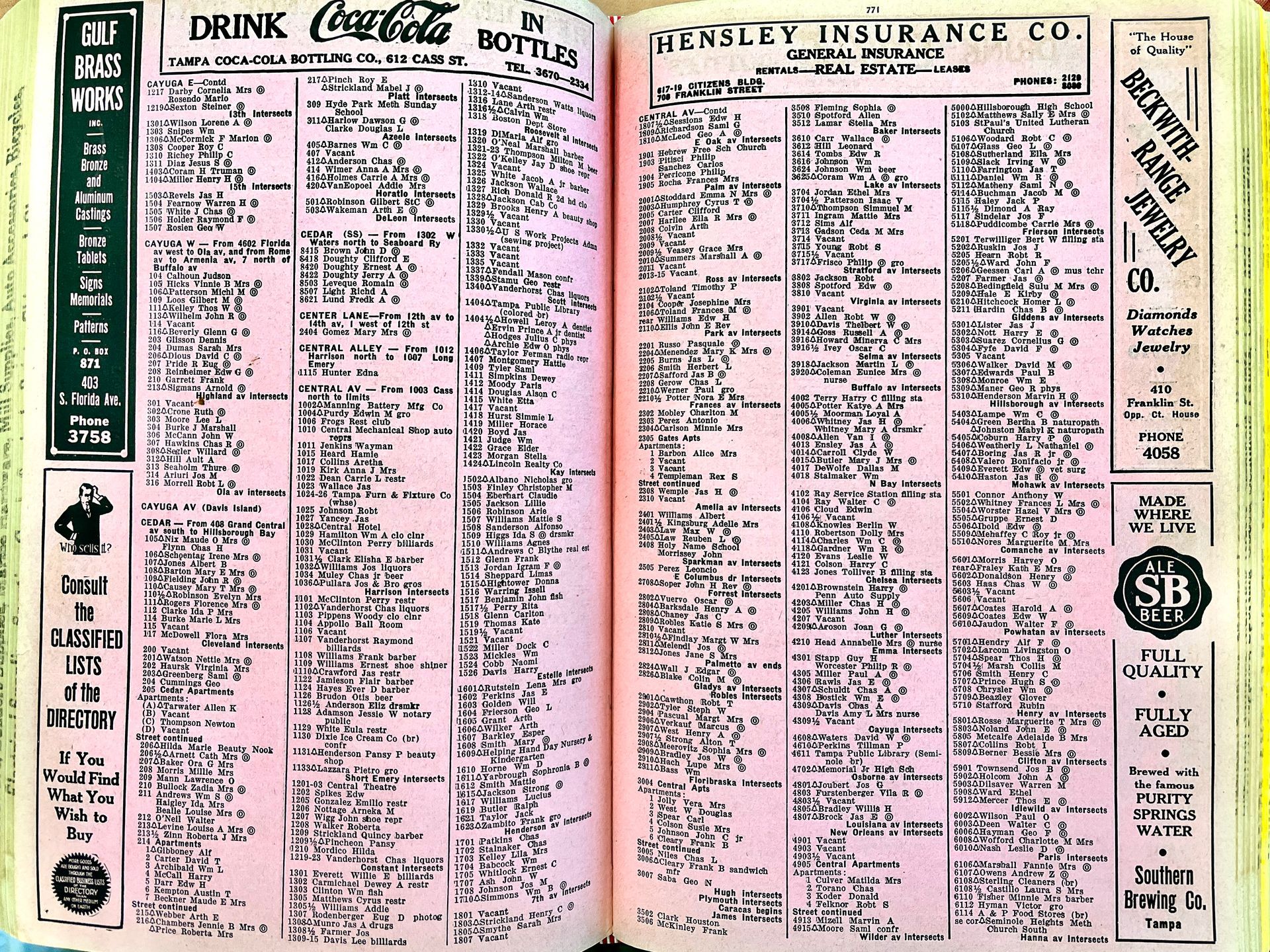 A book is open to a page that says drink coca-cola