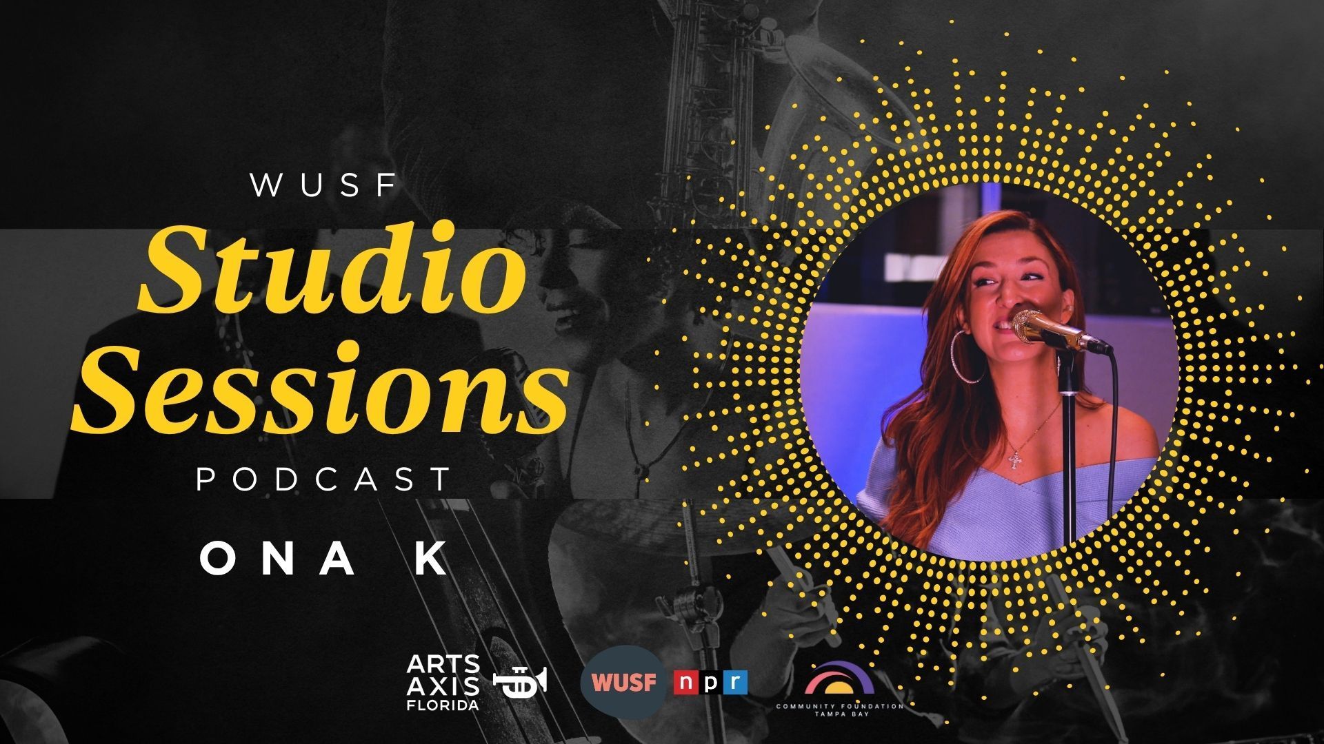 Ona K performing live on a WUSB Studio Sessions podcast. Woman singing, stage, gold accents.