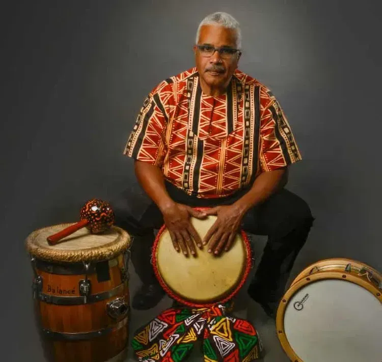 a man is playing a drum that says by lanes on it
