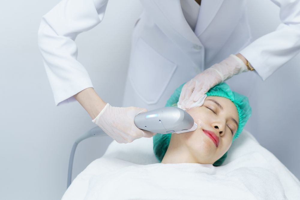 Person Receiving Facial Treatment With a Device — Bombshell Body Bar In Meikleville Hill, QLD