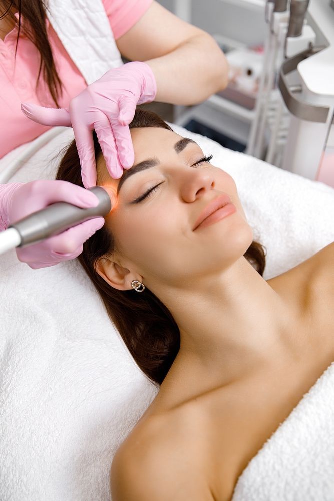 Woman Receiving Facial Treatment — Bombshell Body Bar In Meikleville Hill, QLD