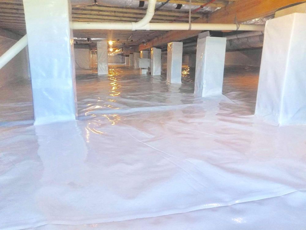 A flooded basement with a lot of water coming out of it.