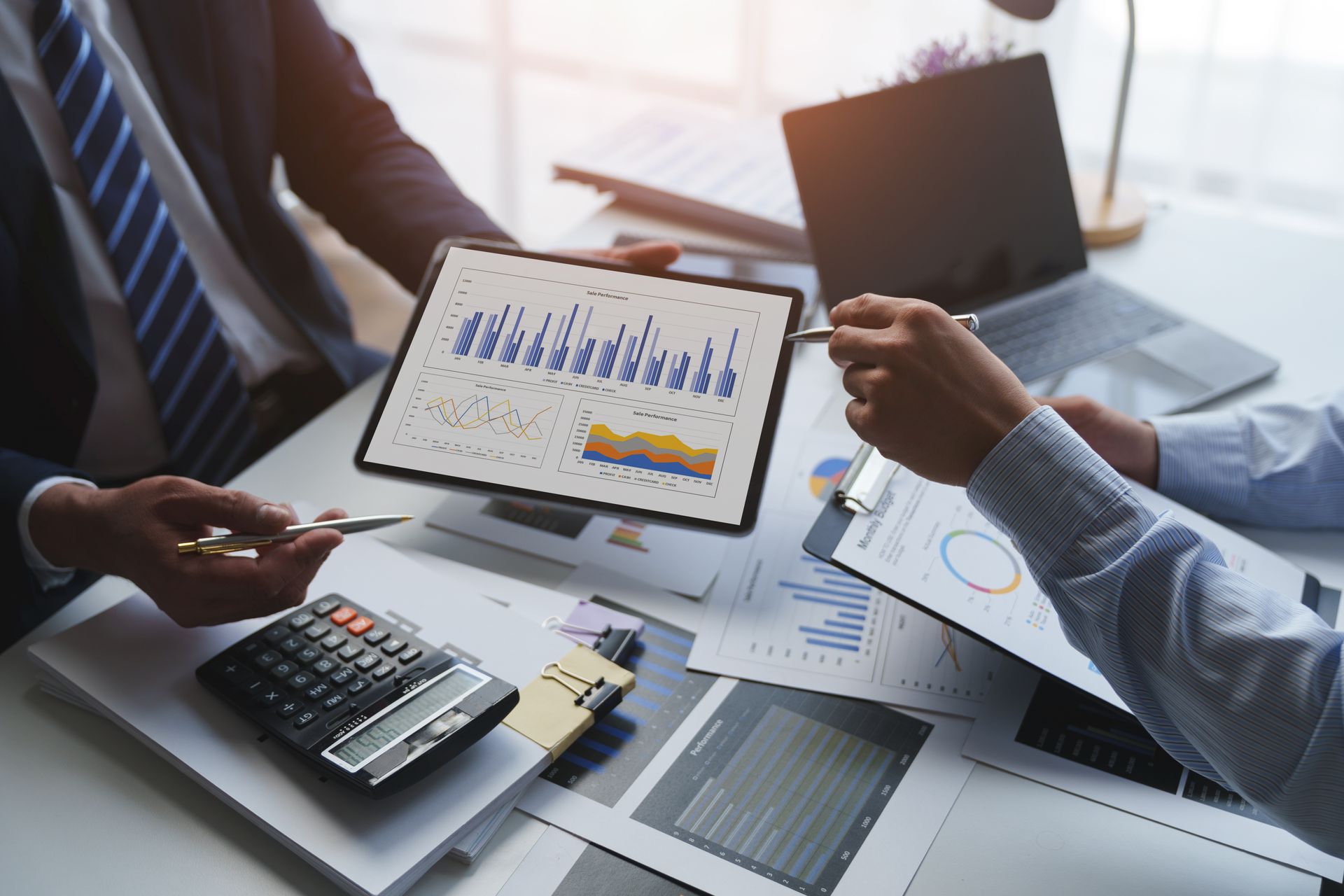 An accountant checking investment results and reviewing financial budget analysis. An accountant checking investment results and reviewing financial budget analysis.