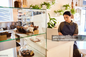 Woman managing accounts and organising receipts for a professional business accounting service.