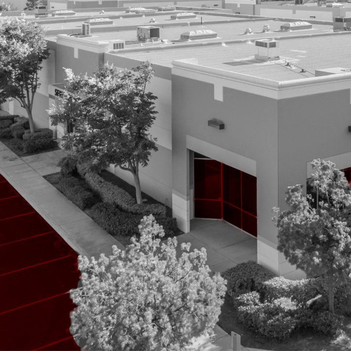 A Black And White Photo Of A Building With Red Doors — Parramatta, NSW — Howard Ghedia