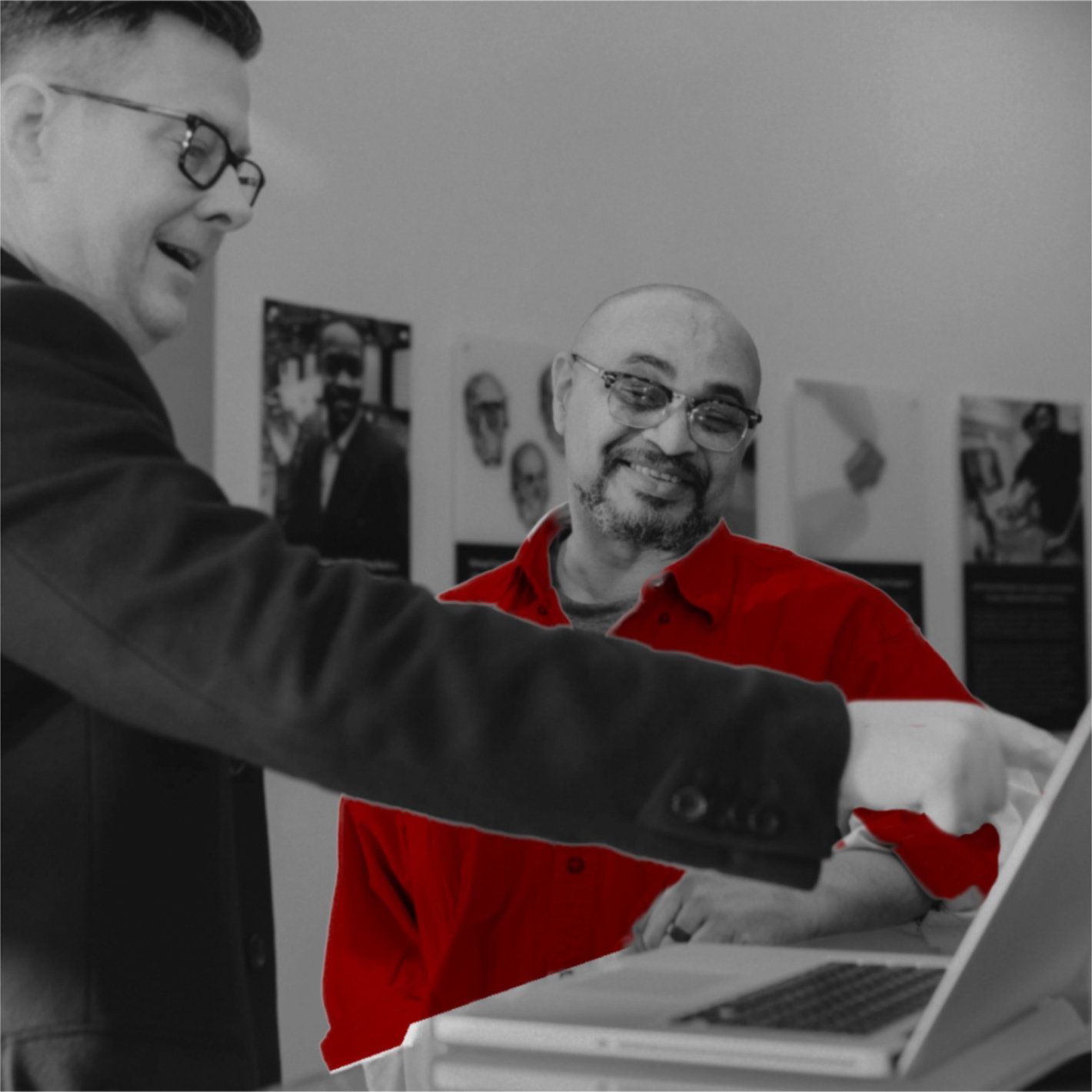 A Man In A Red Shirt Is Pointing At A Laptop — Parramatta, NSW — Howard Ghedia