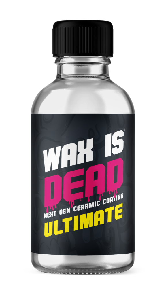 Black bottle with label reading “WAX IS DEAD ULTIMATE” in white, pink, and yellow.