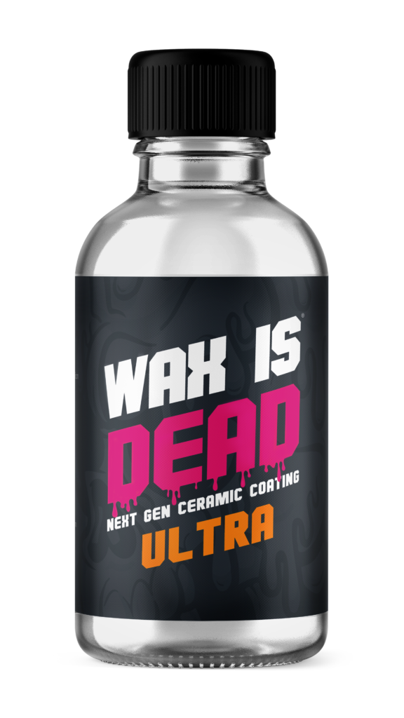 Small clear bottle with black label reading “WAX IS DEAD ULTRA” in white and pink text.