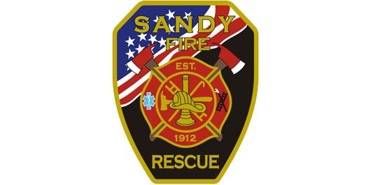 A patch for sandy fire rescue with an american flag in the background