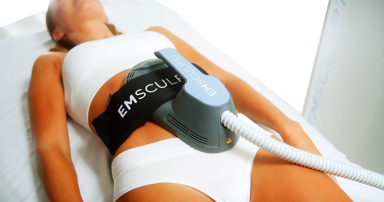 Woman Receiving Emsculpt Neo Treatment with Applicator in CT