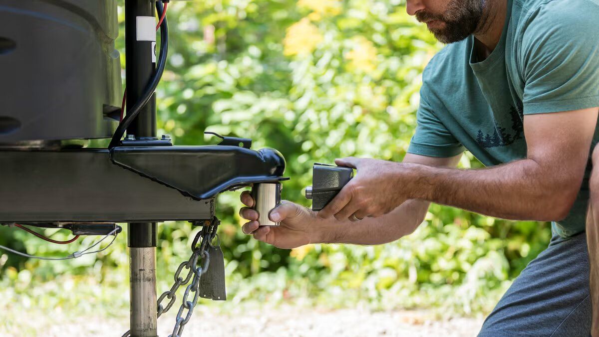 a man installing a trailer hitch lock Littleton Colorado does installing trailer hitch involve drilling