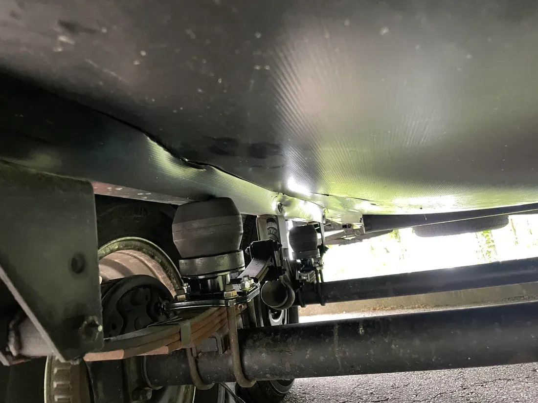 A close up of the underside of a vehicle.