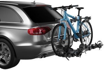 A car with a bike rack attached to the back of it.