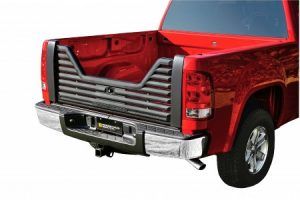 A red truck with a black grille on the back of it