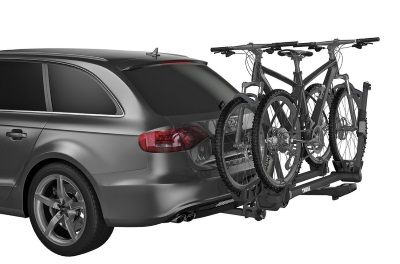 A car with a bike rack attached to the back of it.