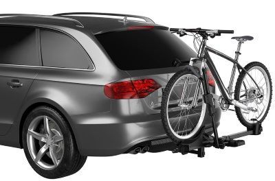 A car with a bike on the back of it.