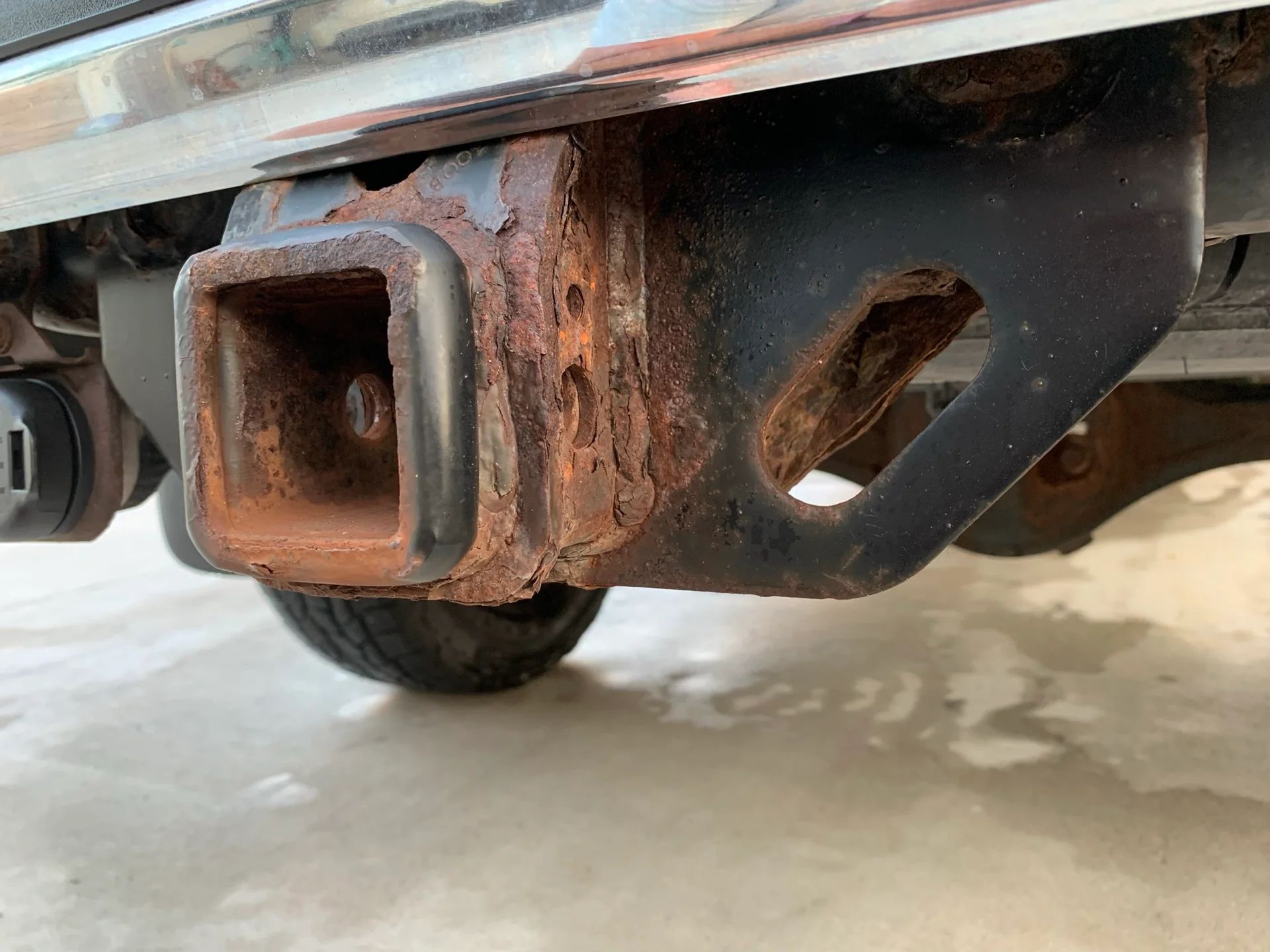 a close up of a rusted trailer hitch Littleton Colorado Preventing Trailer Hitch Corrosion