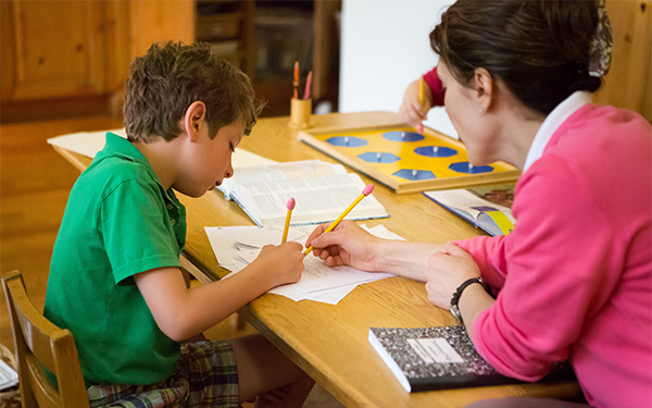 A Montessori teacher edits a student's research paper