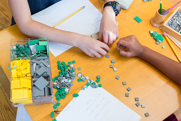 Montessori children working together in the classroom 