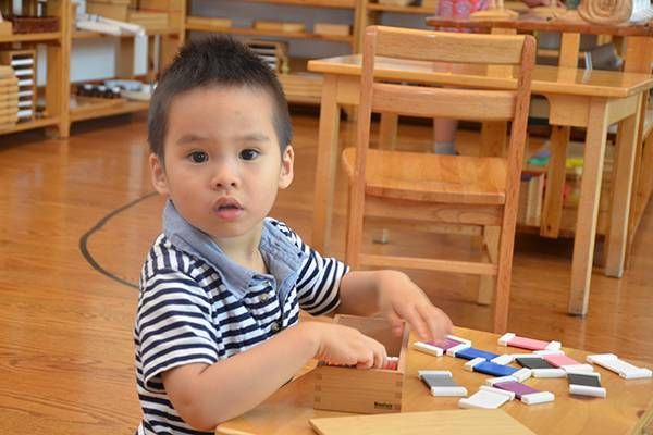 Montessori child working in the classroom 