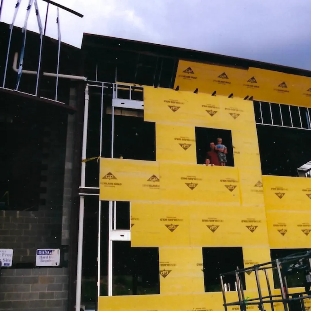 A building under construction with a sign that says ' safety ' on it