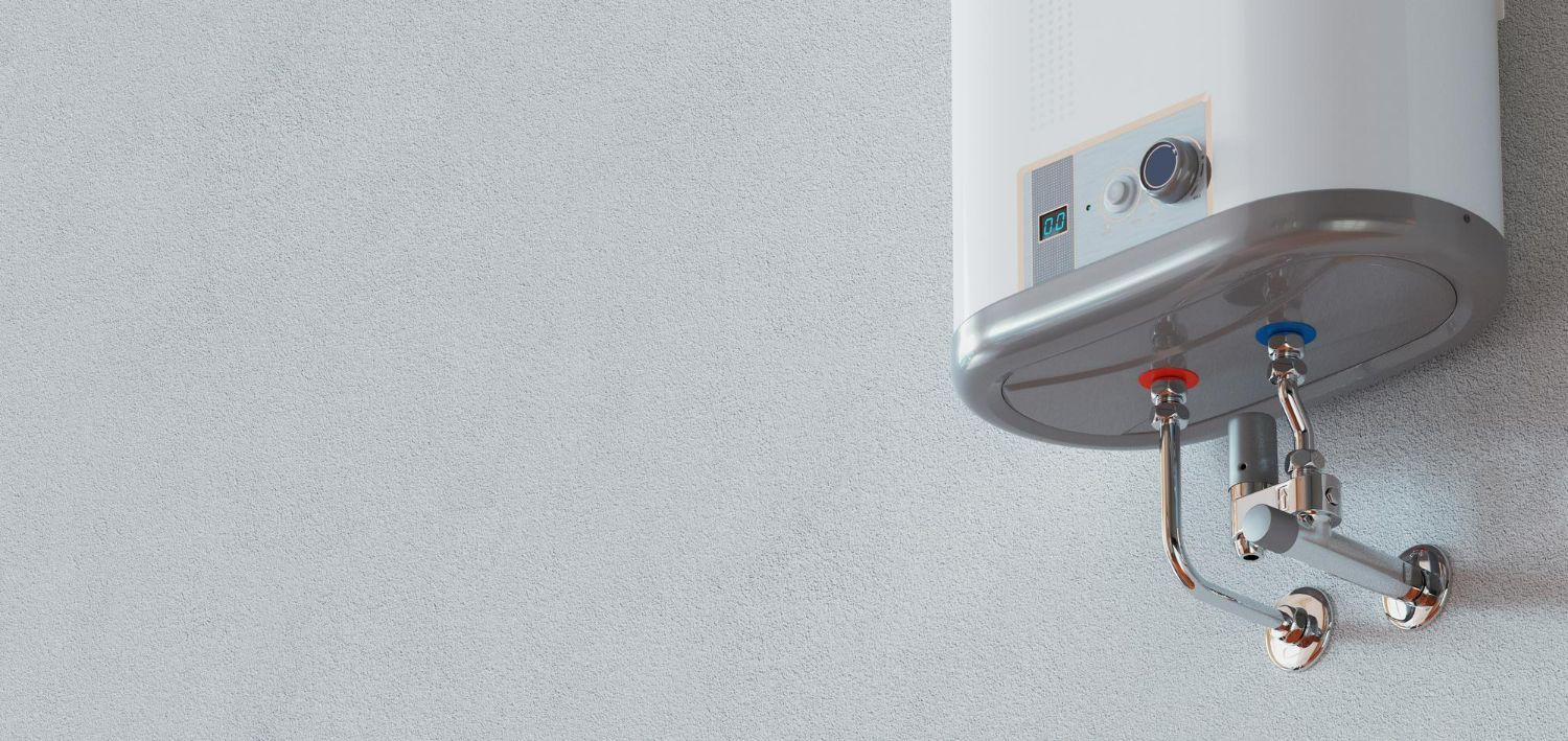 A white water heater is hanging on a white wall.
