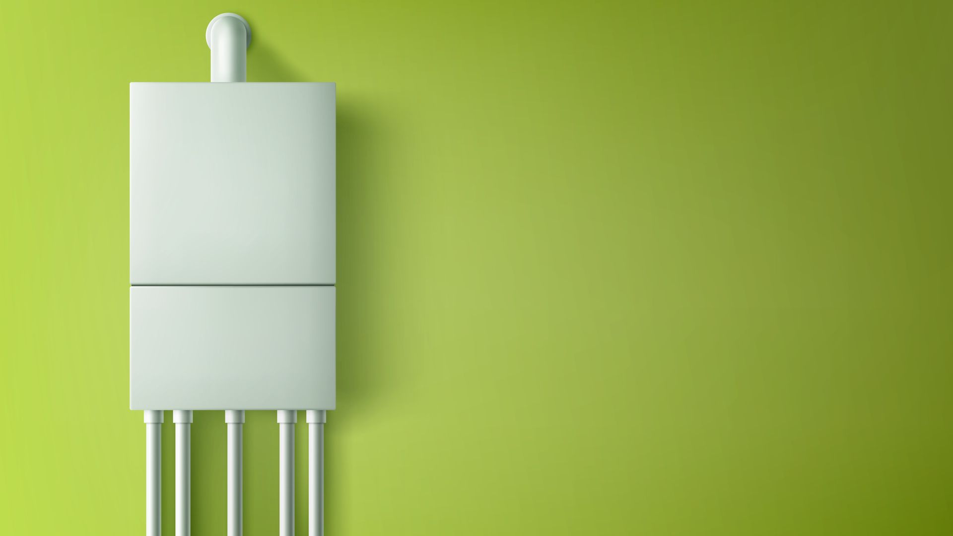 a white boiler is sitting on a green wall .
