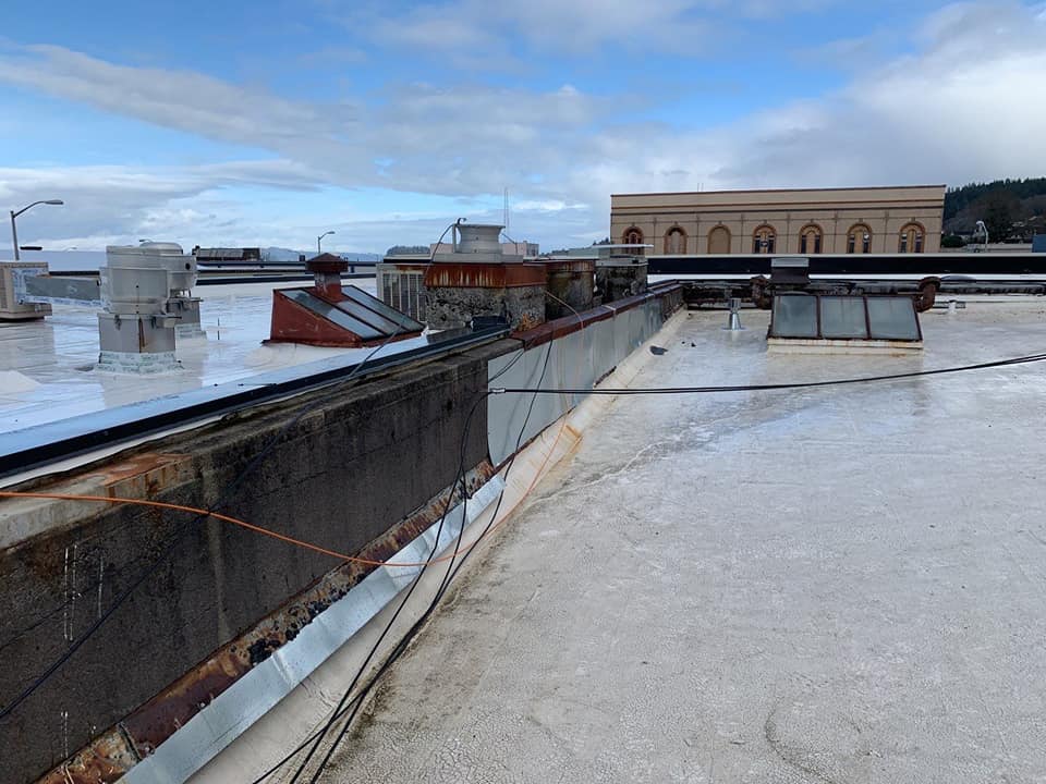 Old Flat Roof of Commercial Building — Astoria, OR — Northwest Roofing & Construction LLC