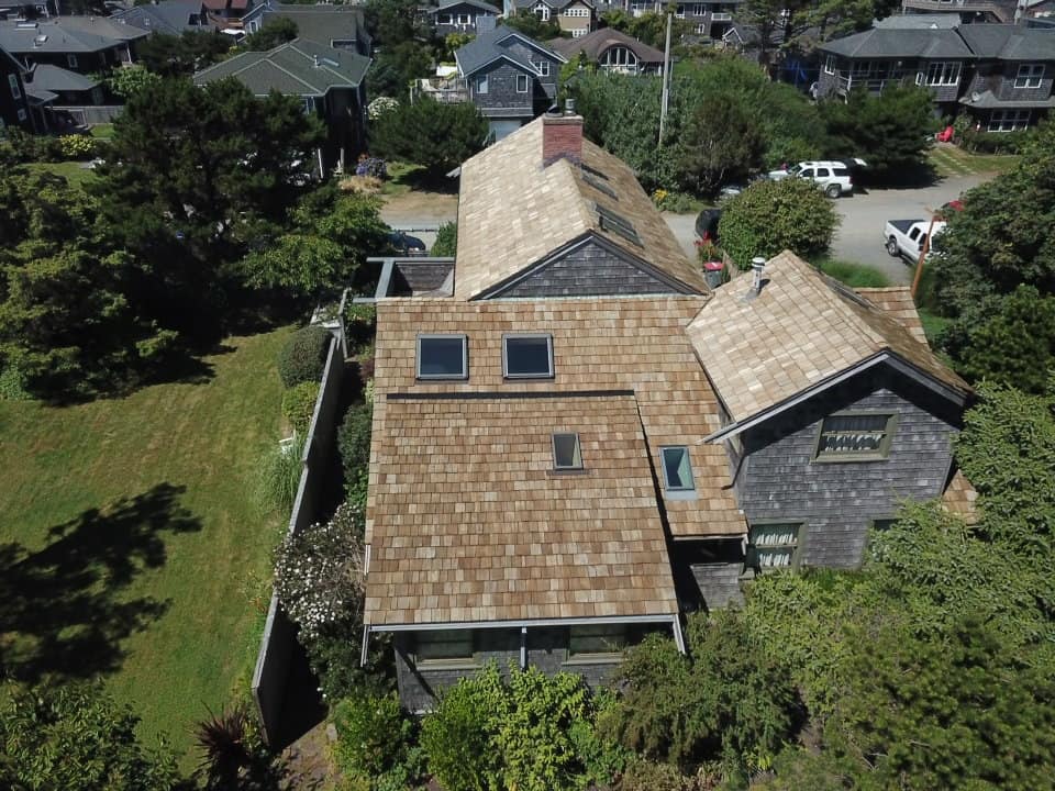 Brown Roof of House in Cannon Beach — Astoria, OR — Northwest Roofing & Construction LLC
