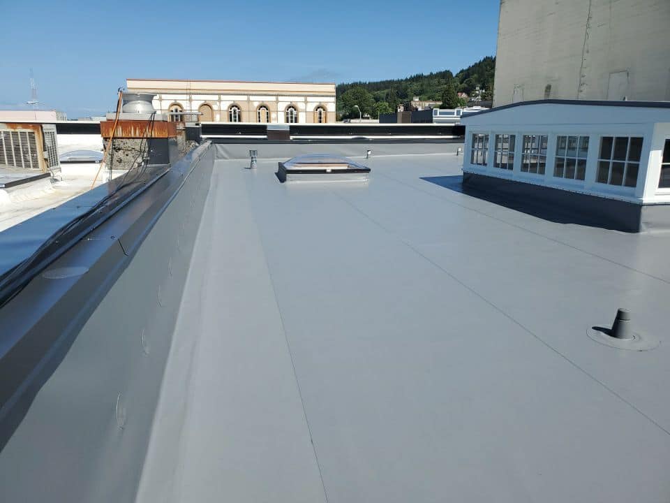 Gray Flat Roof — Astoria, OR — Northwest Roofing & Construction LLC
