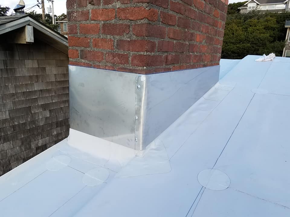 Metal Cover on the Chimney Before — Astoria, OR — Northwest Roofing & Construction LLC